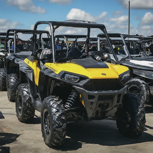 Used Powersports Vehicles for Sale A reliable used UTV carrying supplies on a farm